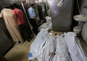 The bodies of Palestinians lie on the ground of the morgue of the al-Shifa hospital